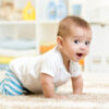 Baby on all fours on carpeted floor